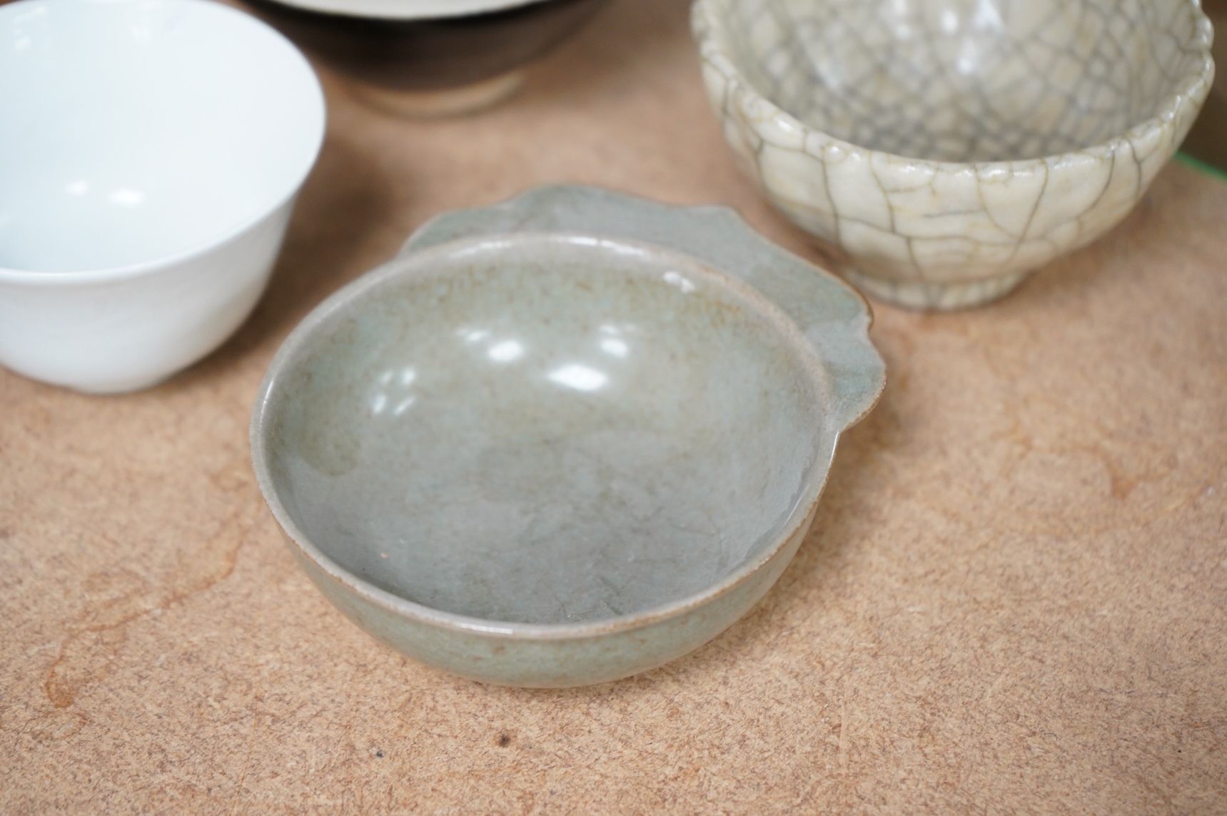 A collection of Chinese porcelain and pottery to include a naturalistic teapot, crackle glaze bowl and a ‘dragon’ bowl, largest 10cm in diameter